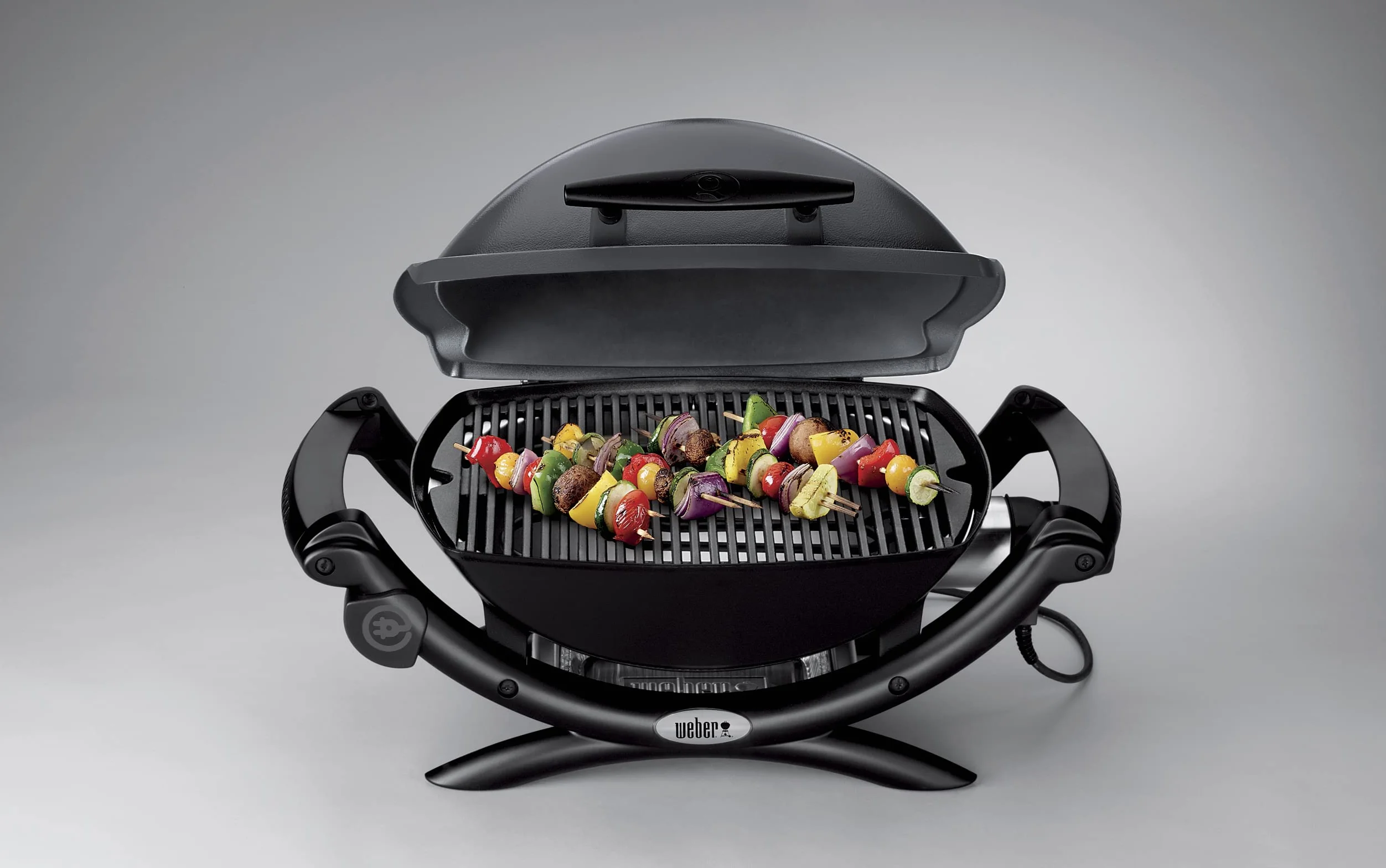 Weber Q1400 Elektryczny Grill, powierzchnia grillowania 43 x 32 cm, przenośny BBQ Grill,2-częściowy żeliwny ruszt pokryty emalią porcelanową, pokrywa i obudowa aluminiowa - Ciemnoszary (52020079)