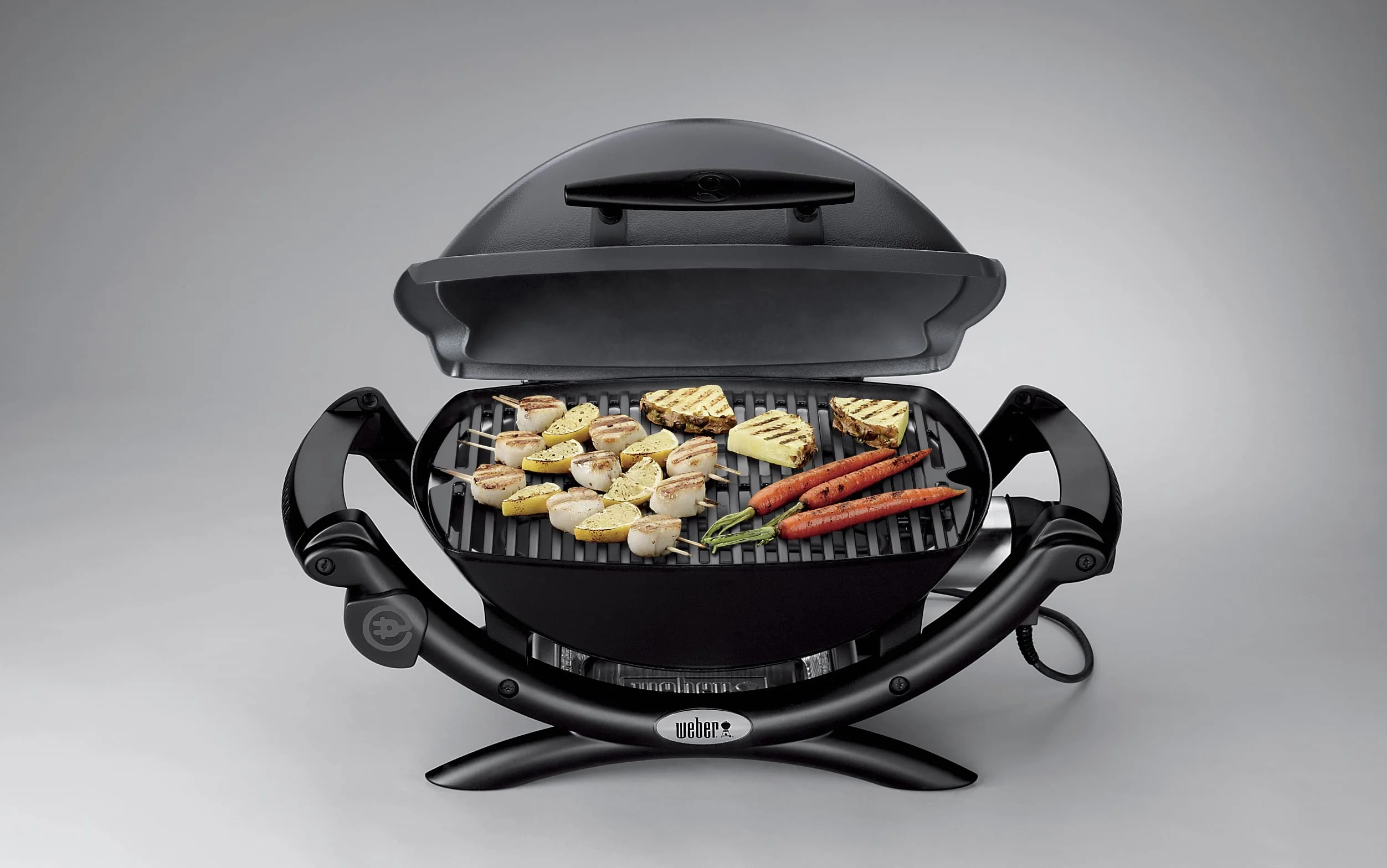 Weber Q1400 Elektryczny Grill, powierzchnia grillowania 43 x 32 cm, przenośny BBQ Grill,2-częściowy żeliwny ruszt pokryty emalią porcelanową, pokrywa i obudowa aluminiowa - Ciemnoszary (52020079)
